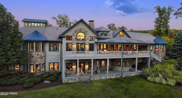 130 Calico Ct, Paupack, PA 18451 - back of house featuring a patio, a yard, stone siding, and a chimney