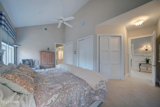 130 Calico Ct, Paupack, PA 18451 - bedroom featuring multiple closets, high vaulted ceiling, visible vents, and light carpet
