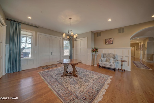 130 Calico Ct, Paupack, PA 18451 - entryway with a decorative wall, arched walkways, visible vents, and a chandelier