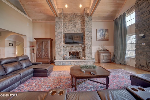 130 Calico Ct, Paupack, PA 18451 - living room with high vaulted ceiling, a fireplace, wood ceiling, and wood finished floors