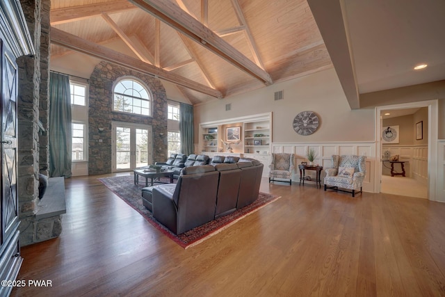 130 Calico Ct, Paupack, PA 18451 - living area featuring visible vents, beamed ceiling, wood ceiling, wainscoting, and wood finished floors