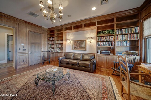 130 Calico Ct, Paupack, PA 18451 - living room with light wood-type flooring, visible vents, and built in shelves