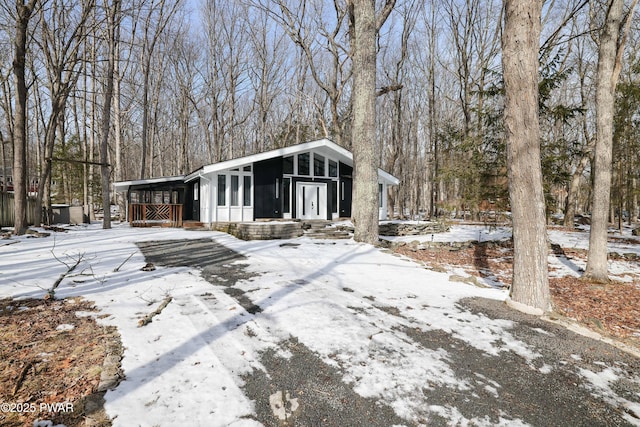 view of front of property featuring a sunroom