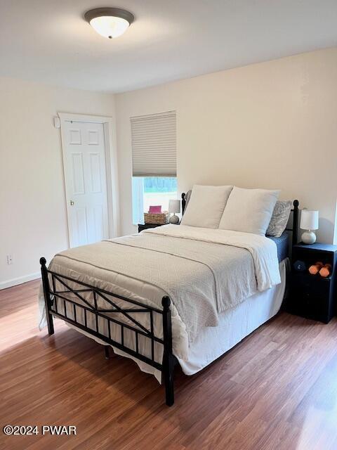 bedroom featuring hardwood / wood-style flooring