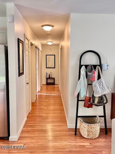 hall with light hardwood / wood-style flooring