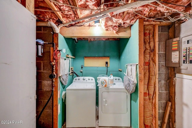 clothes washing area featuring washer and clothes dryer