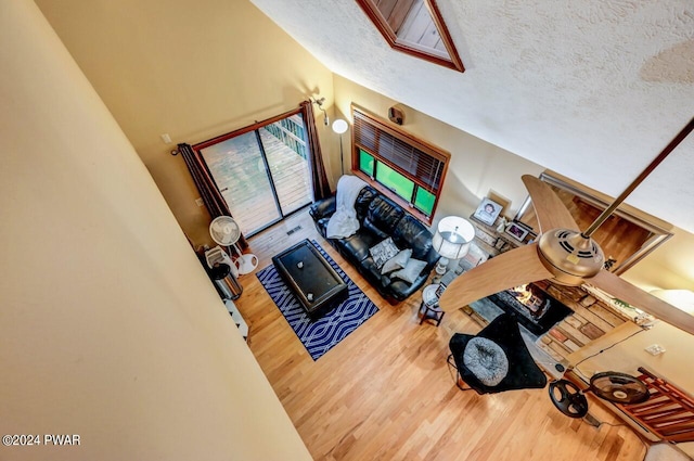 living room featuring hardwood / wood-style floors and a textured ceiling