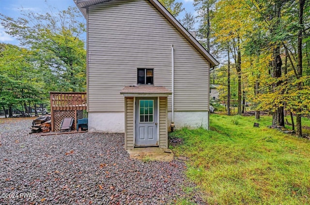 back of house featuring a wooden deck