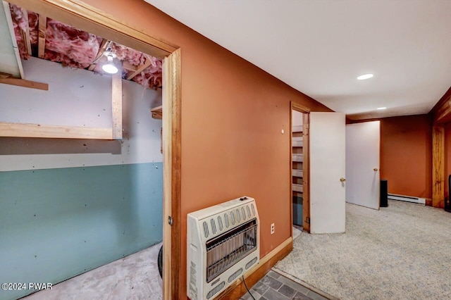 basement with a baseboard radiator and heating unit