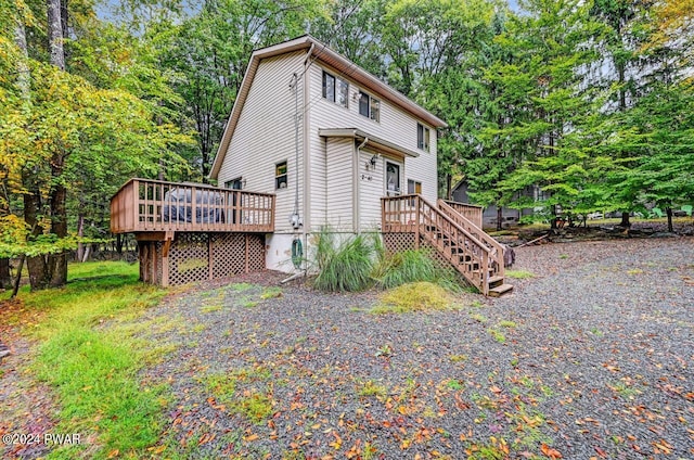 view of home's exterior featuring a deck