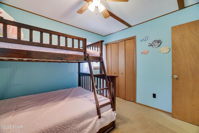 1706 Windemere Ct, Lake Ariel, PA 18436 - carpeted bedroom featuring a closet, wooden walls, and a ceiling fan