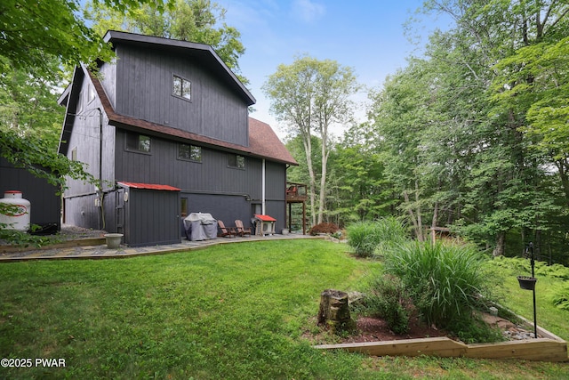 1706 Windemere Ct, Lake Ariel, PA 18436 - back of property featuring a lawn and roof with shingles
