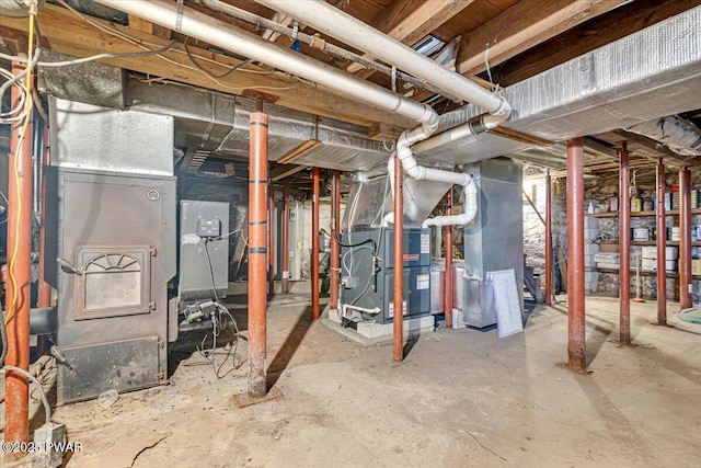 unfinished basement featuring heating unit