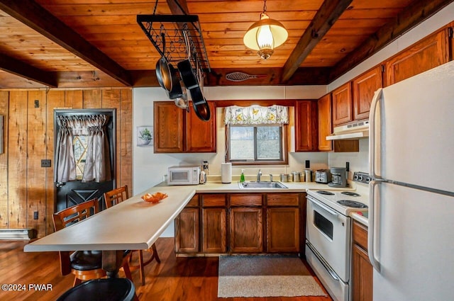 kitchen with beam ceiling, sink, white appliances, decorative light fixtures, and wood ceiling