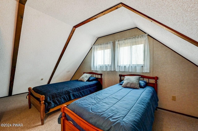 bedroom with carpet and lofted ceiling