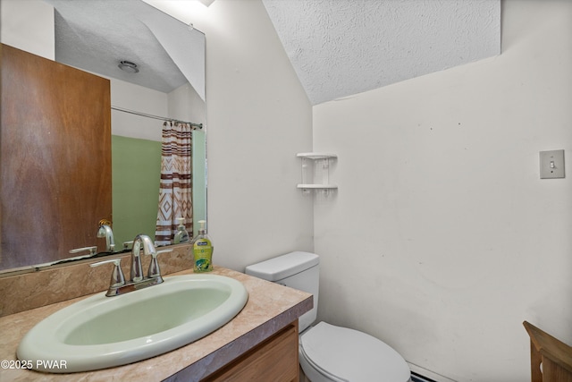 bathroom with a textured ceiling, curtained shower, vanity, toilet, and lofted ceiling