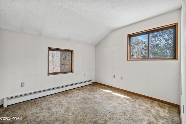 bonus room with vaulted ceiling, a baseboard heating unit, carpet flooring, and a wealth of natural light