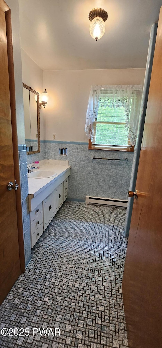 24 Buff Rd, Cochecton, Ny, NY 12726 - bathroom featuring vanity, a wainscoted wall, tile walls, and baseboard heating