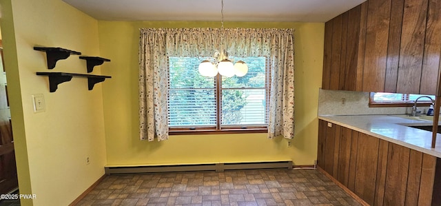 24 Buff Rd, Cochecton, Ny, NY 12726 - unfurnished dining area featuring a baseboard radiator, a chandelier, brick patterned flooring, and a sink