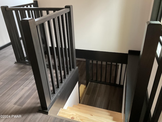 stairs with wood-type flooring