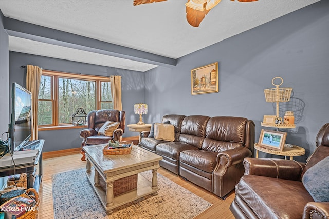 216 Comstock Dr, Lords Valley, PA 18428 - living room featuring a ceiling fan, light wood-style floors, and beam ceiling