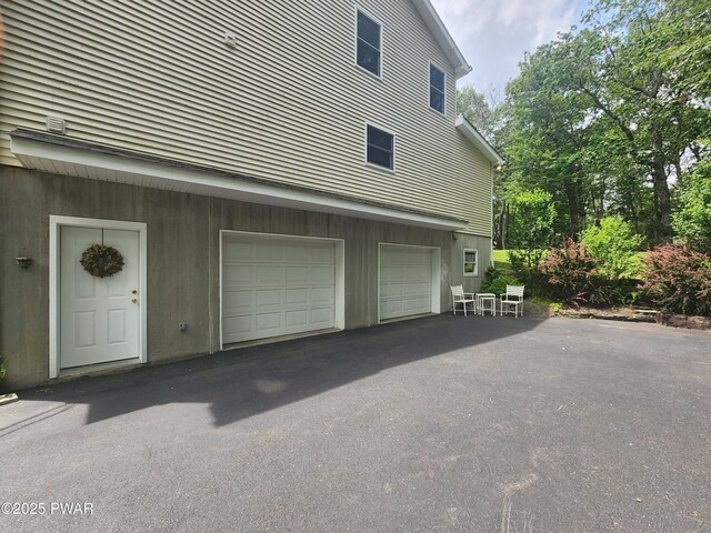 216 Comstock Dr, Lords Valley, PA 18428 - garage featuring driveway