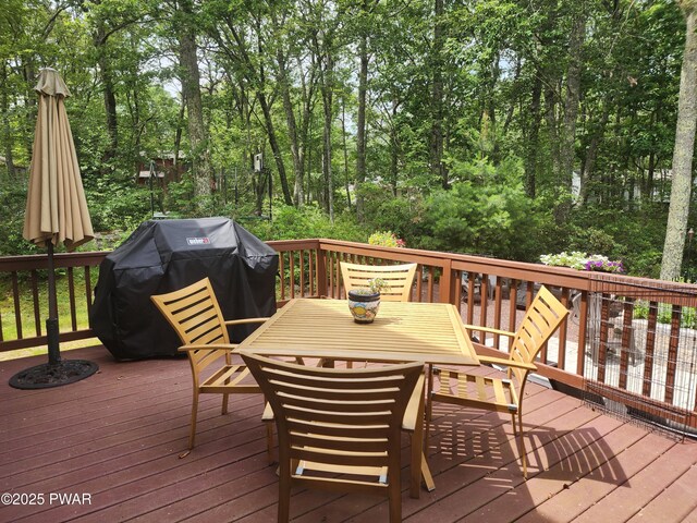 216 Comstock Dr, Lords Valley, PA 18428 - rear view of property featuring a wooden deck, a sunroom, and roof with shingles