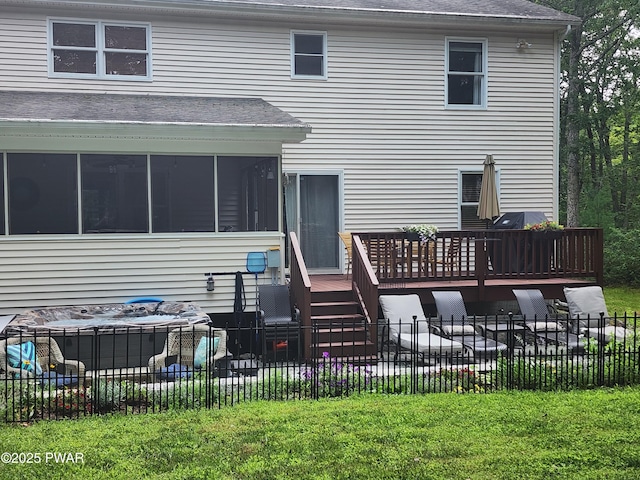 216 Comstock Dr, Lords Valley, PA 18428 - rear view of property featuring a wooden deck, a sunroom, and roof with shingles