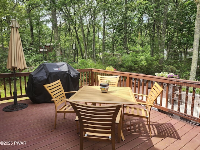 216 Comstock Dr, Lords Valley, PA 18428 - wooden terrace with a grill and outdoor dining space
