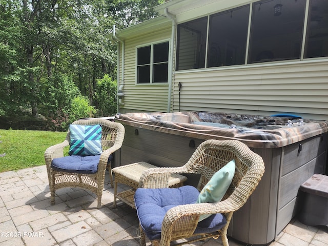216 Comstock Dr, Lords Valley, PA 18428 - view of patio with a hot tub and a sunroom
