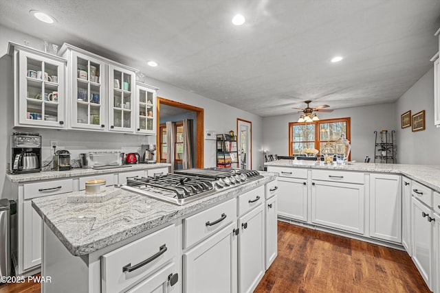 216 Comstock Dr, Lords Valley, PA 18428 - kitchen featuring stainless steel gas stovetop, ceiling fan, recessed lighting, glass insert cabinets, and white cabinets