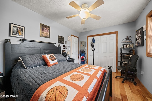 216 Comstock Dr, Lords Valley, PA 18428 - bedroom featuring light wood-style flooring, a ceiling fan, and a textured ceiling