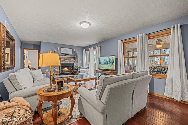 216 Comstock Dr, Lords Valley, PA 18428 - living area featuring a fireplace, dark wood-style flooring, and a textured ceiling