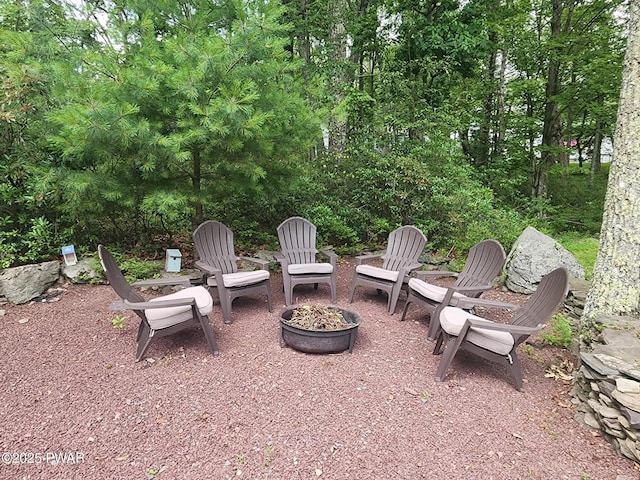 216 Comstock Dr, Lords Valley, PA 18428 - view of patio with an outdoor fire pit