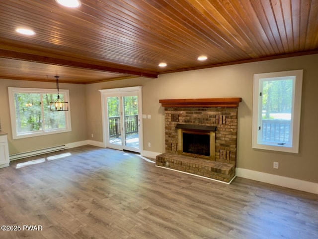 17 Applegate Rd, Lake Ariel, PA 18436 - unfurnished living room with wooden ceiling, a baseboard heating unit, a chandelier, a fireplace, and baseboards