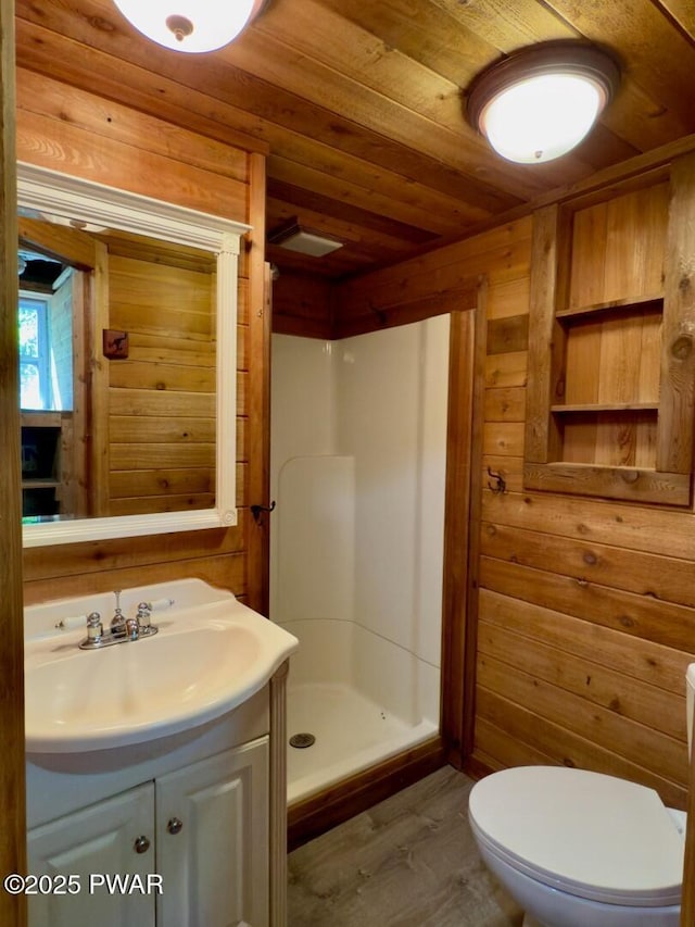 17 Applegate Rd, Lake Ariel, PA 18436 - bathroom featuring a shower stall, wood walls, vanity, wooden ceiling, and toilet