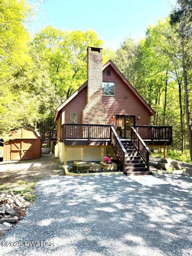 17 Applegate Rd, Lake Ariel, PA 18436 - view of front of home featuring a wooden deck, a chimney, and stairway