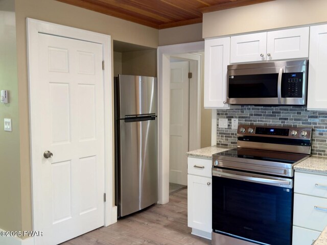 17 Applegate Rd, Lake Ariel, PA 18436 - kitchen featuring stainless steel appliances, wood ceiling, light wood finished floors, white cabinets, and crown molding