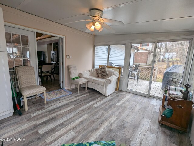 sunroom with ceiling fan and a wealth of natural light