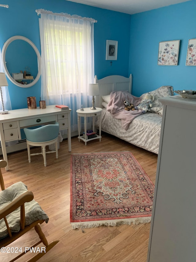 bedroom featuring wood-type flooring