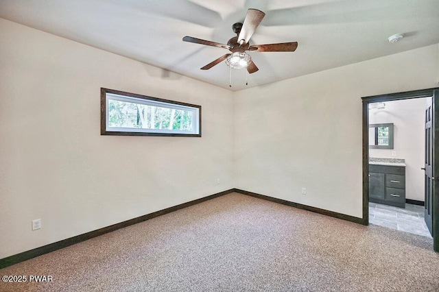 unfurnished room with ceiling fan