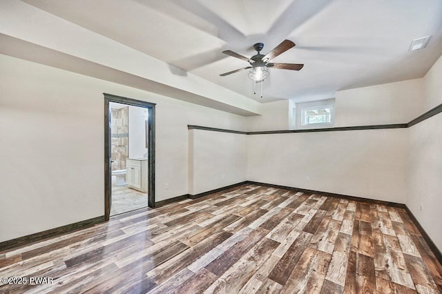 spare room featuring ceiling fan and hardwood / wood-style floors