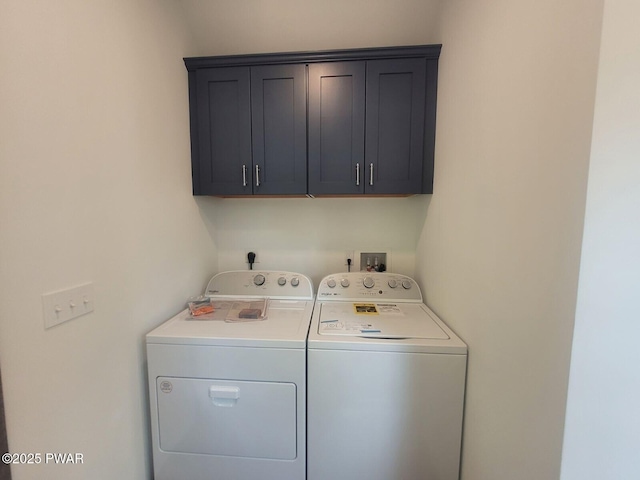 laundry area featuring cabinets and independent washer and dryer