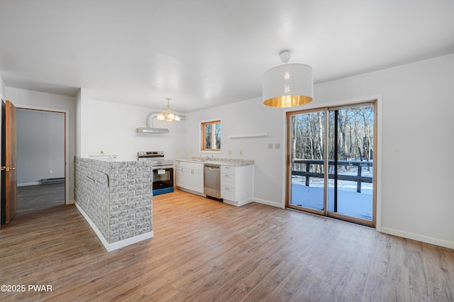 kitchen with an inviting chandelier, stainless steel appliances, light hardwood / wood-style floors, white cabinets, and decorative light fixtures