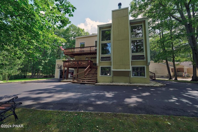 view of property featuring stairs