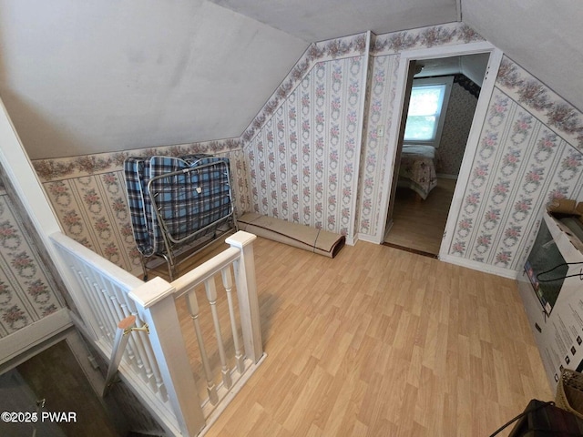 10 Kane Rd, Starlight, PA 18461 - additional living space featuring wood finished floors, lofted ceiling, wallpapered walls, and a baseboard heating unit