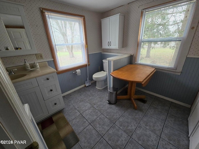 10 Kane Rd, Starlight, PA 18461 - bathroom with wallpapered walls, healthy amount of natural light, wainscoting, vanity, and tile patterned floors