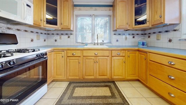 10 Kane Rd, Starlight, PA 18461 - kitchen featuring gas range, white microwave, backsplash, and light countertops
