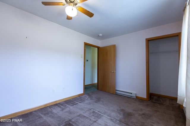 unfurnished bedroom with a baseboard heating unit, carpet flooring, a ceiling fan, baseboards, and a closet