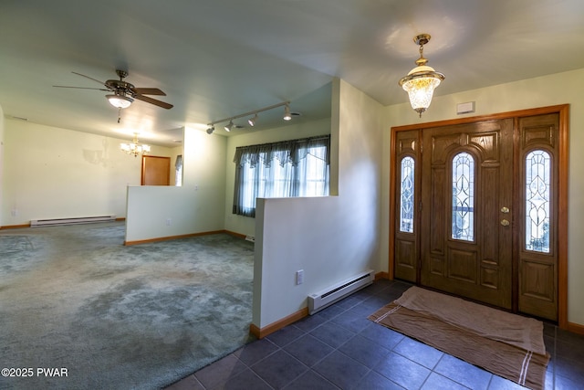 entryway with a baseboard heating unit, dark colored carpet, dark tile patterned flooring, and baseboards